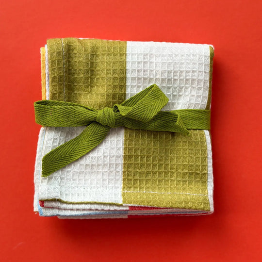 Potluck Waffle Tea Towel by Mel Andrel