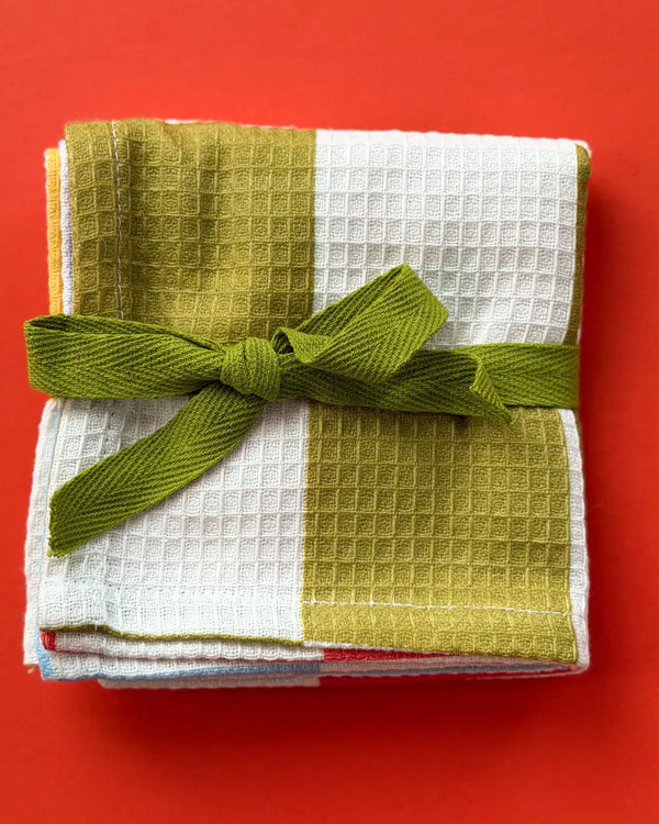Potluck Waffle Tea Towel by Mel Andrel